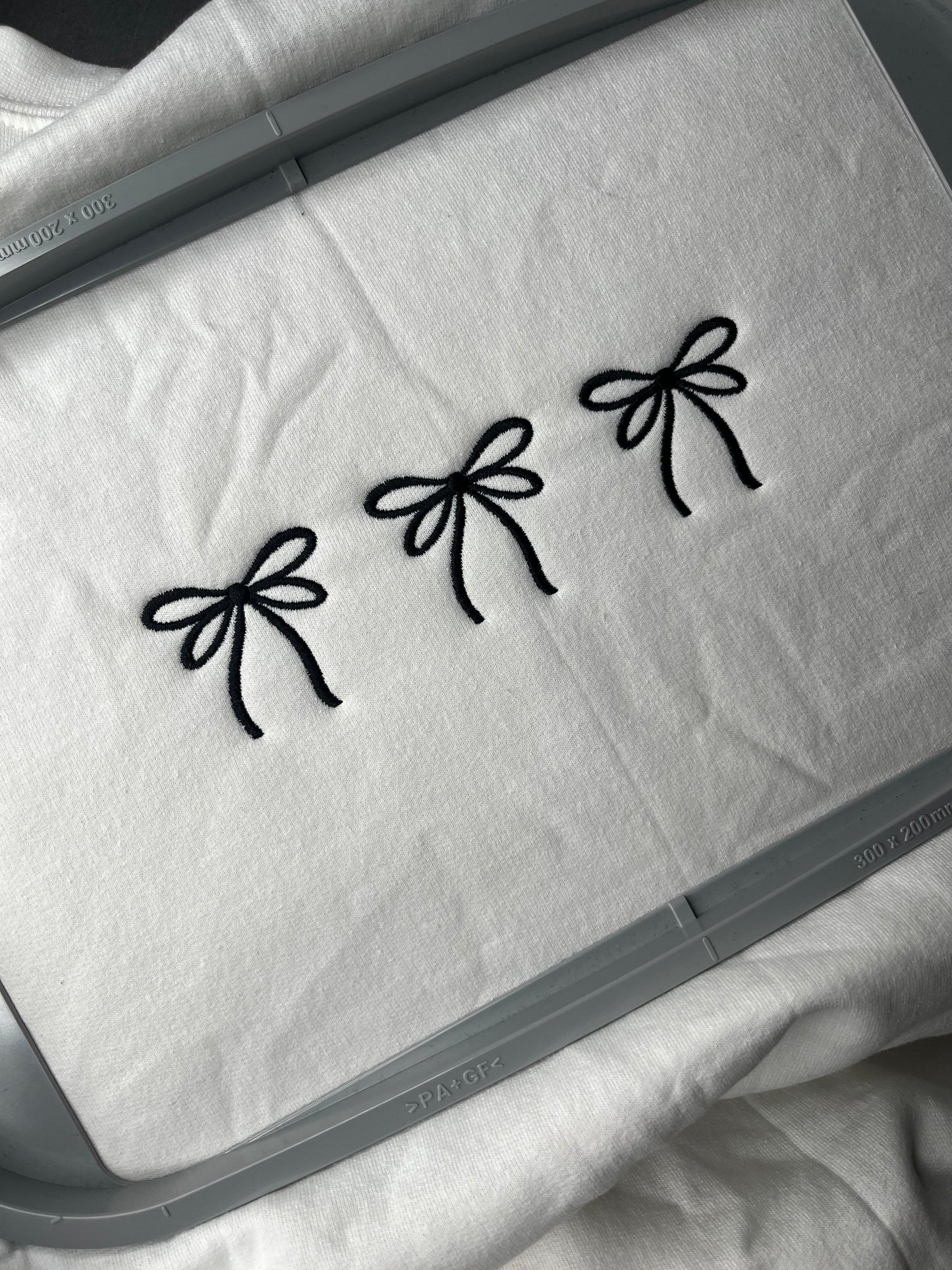 EMBROIDERED BOWS