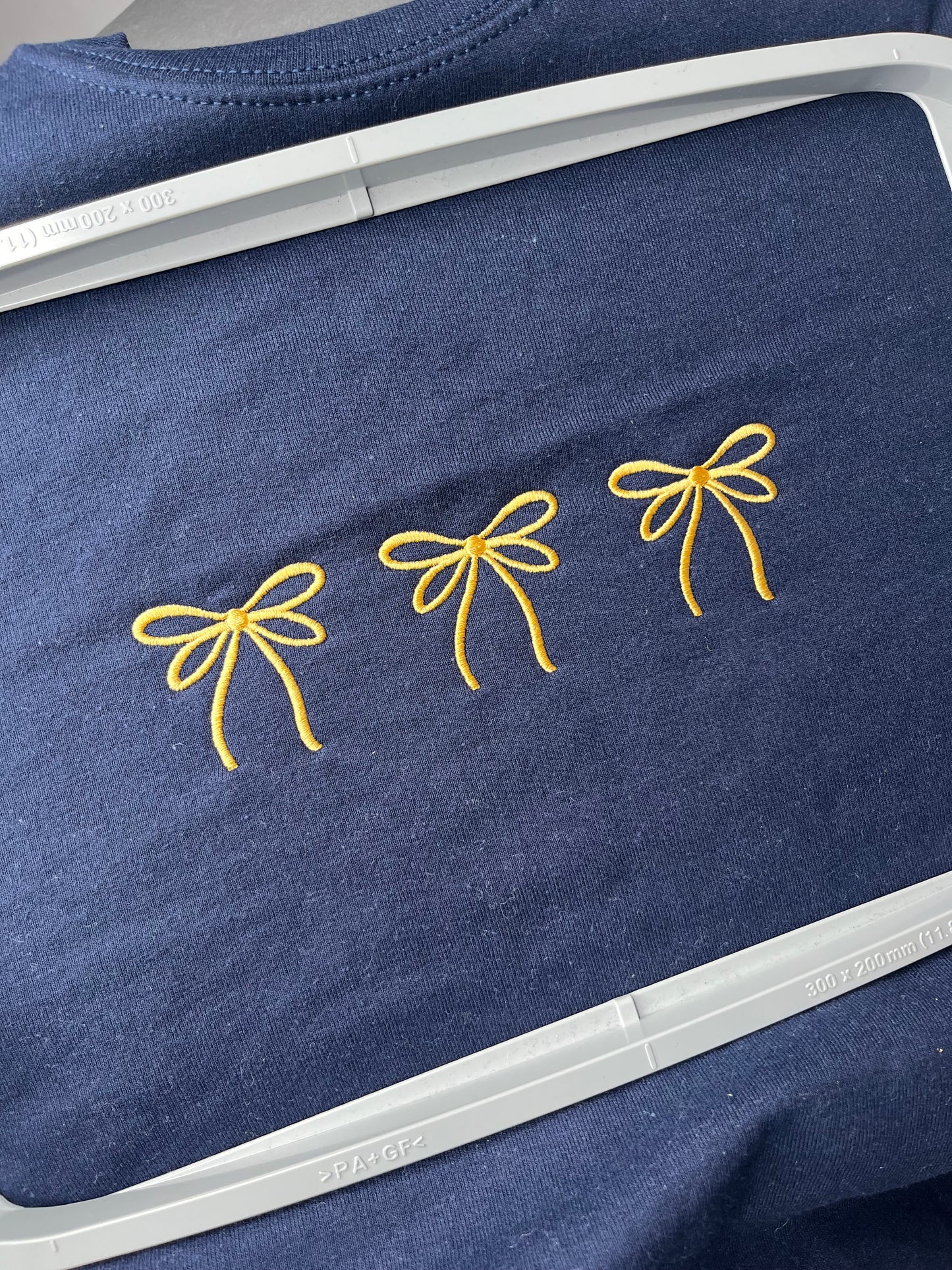 EMBROIDERED BOWS
