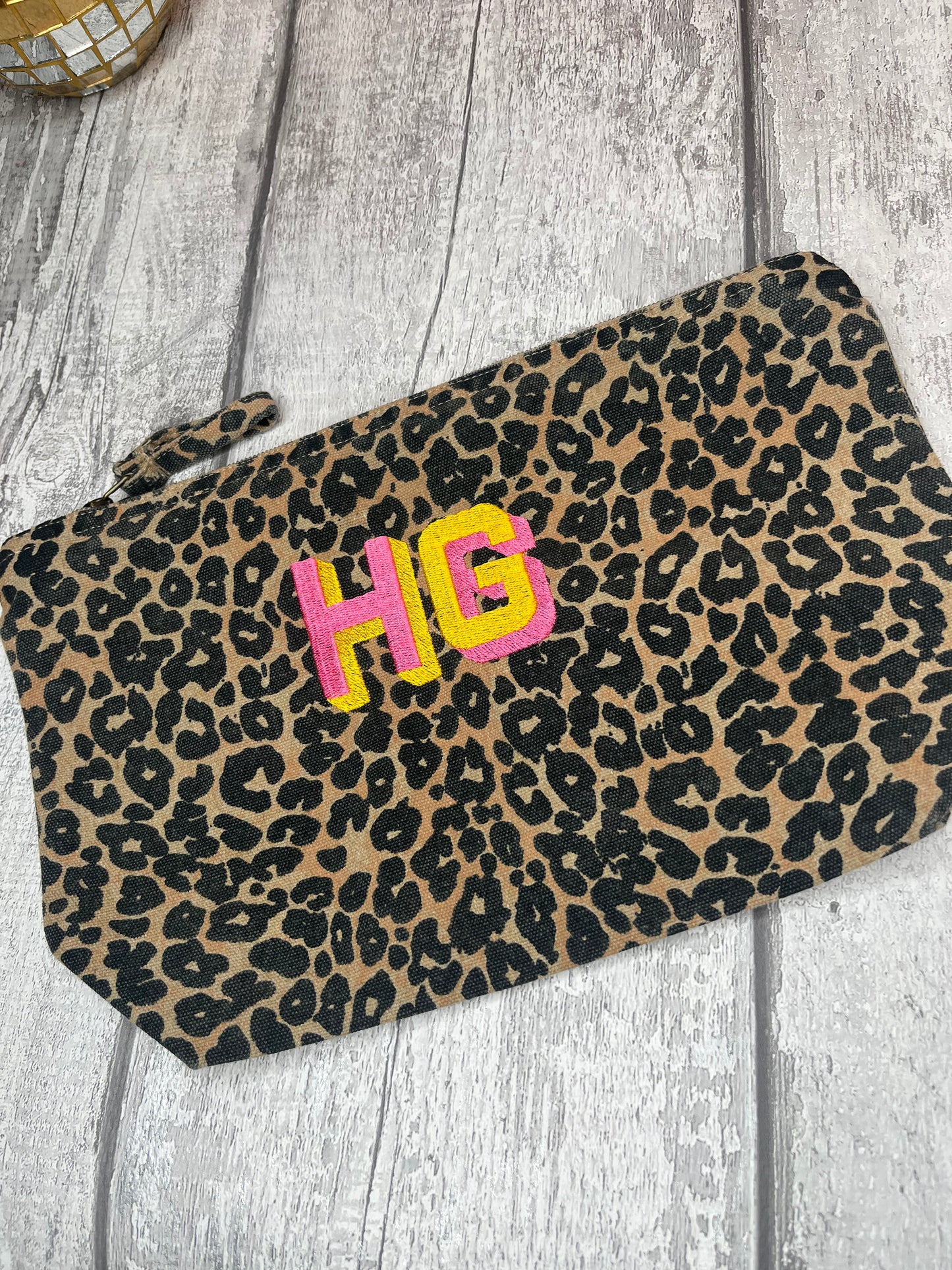EMBROIDERED ANIMAL PRINT SHADOW FONT POUCH