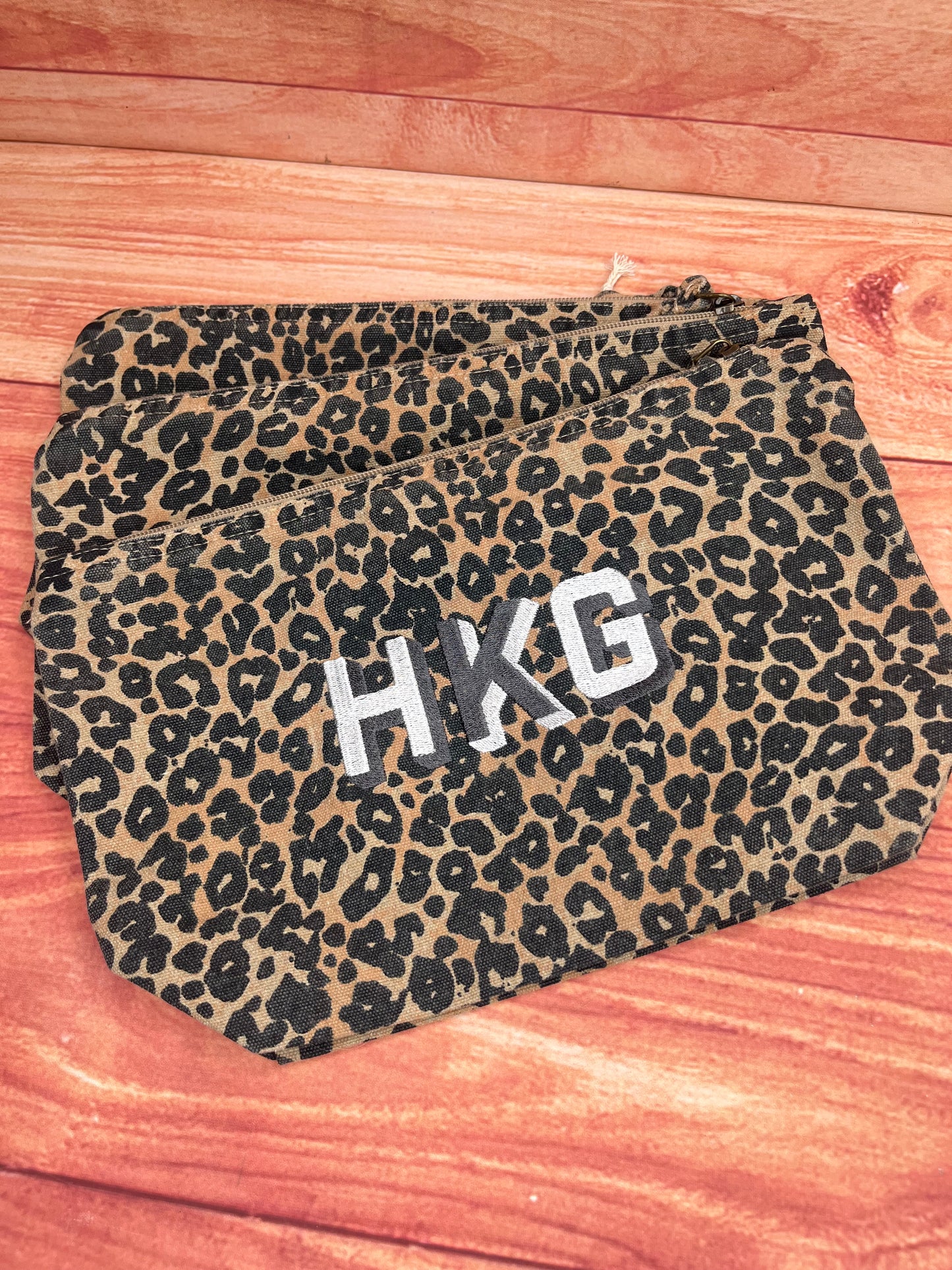 EMBROIDERED ANIMAL PRINT SHADOW FONT POUCH