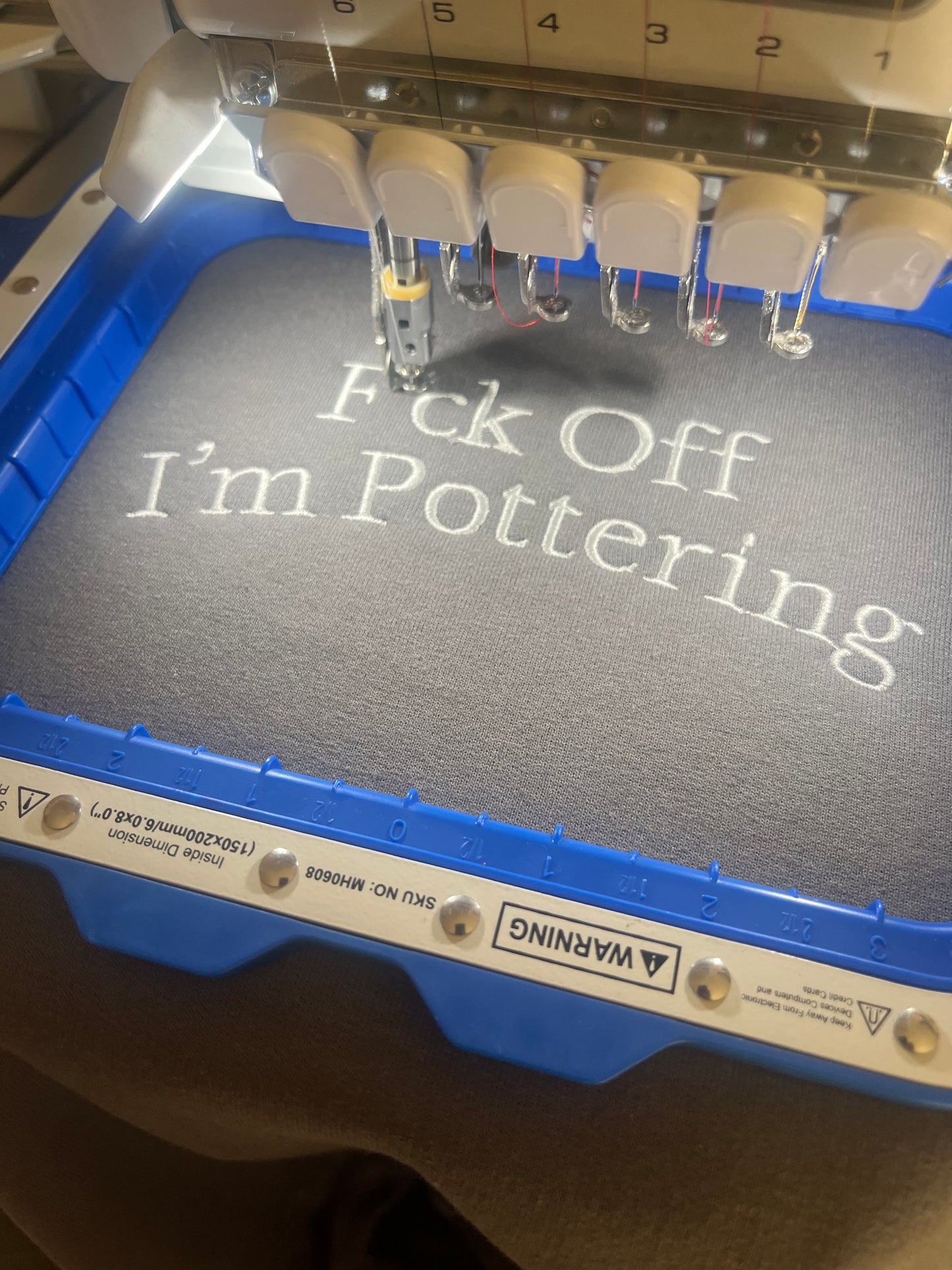 F*CK OFF IM POTTERING EMBROIDERED SWEATSHIRT