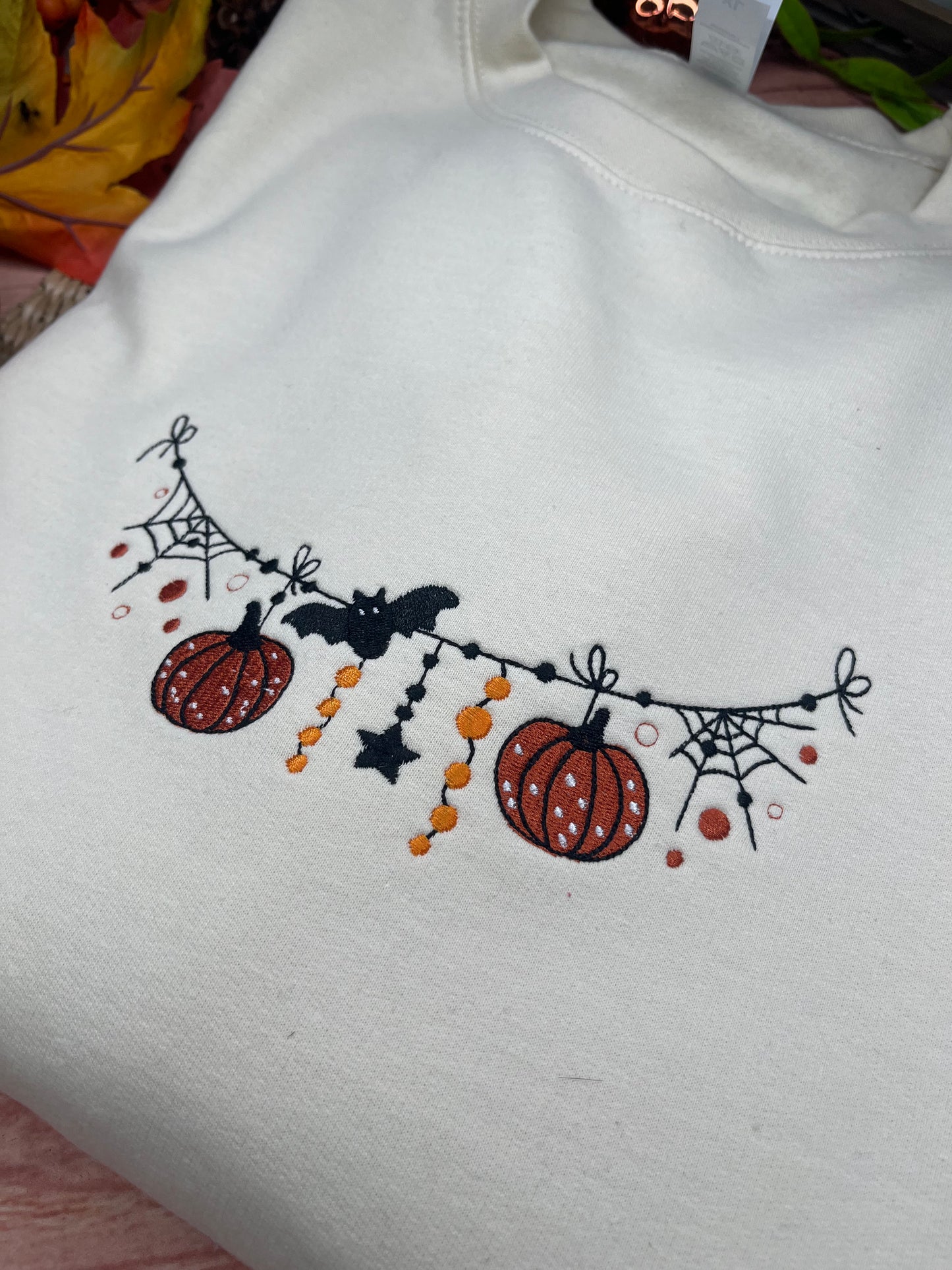 SPOOKY SEASON GARLAND EMBROIDERED SWEATSHIRT